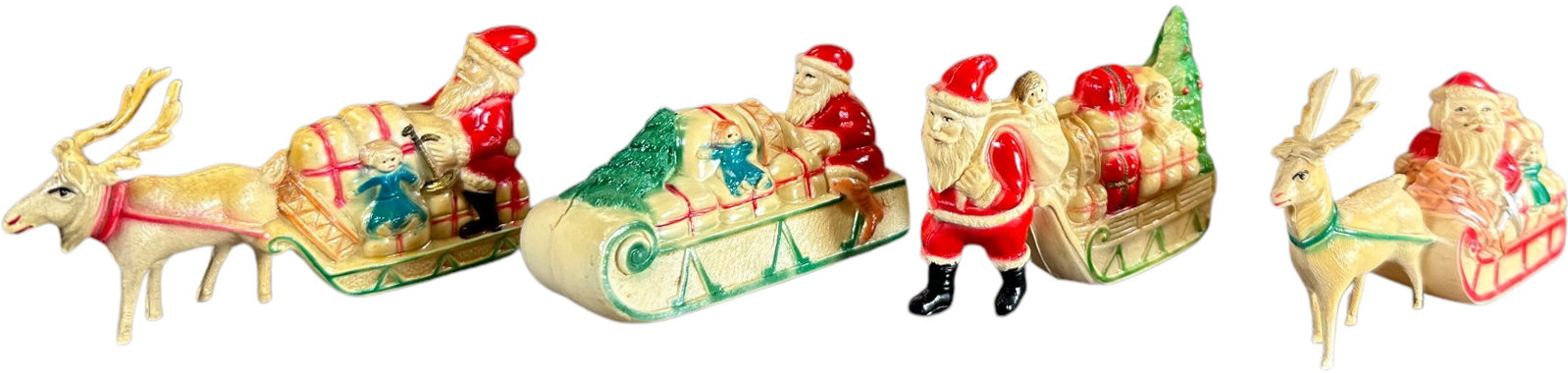 FOUR SANTA CELLULOID TRANSPORTATION PIECES: 490. FOUR SANTA CELLULOID TRANSPORTATION PIECES | 3.5" l. | (Excellent Condition) | $300 - $600