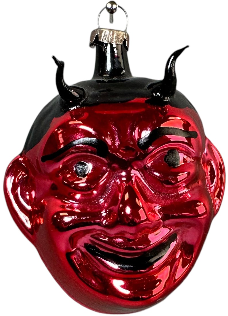 DEVIL HEAD GLASS CHRISTMAS ORNAMENTS: 530. DEVIL HEAD GLASS CHRISTMAS ORNAMENTS | Post war with glass horns. | 3" h. | (Excellent Condition) | $100 - $200