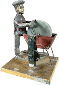 GERMAN TIN WIND-UP BLACKSMITH TOY