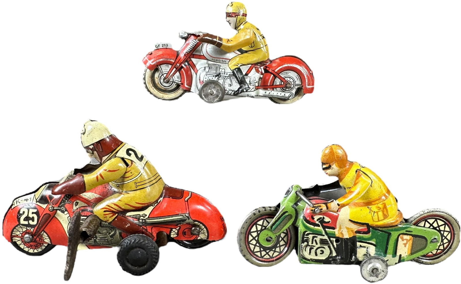 THREE SMALL MOTORCYCLE PENNY TOYS (1 of 5)