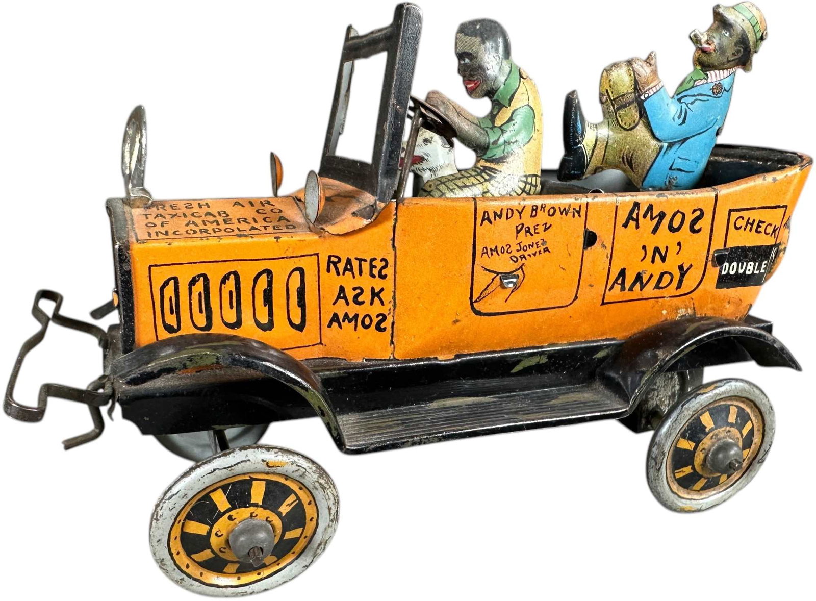 MARX AMOS N ANDY FRESH AIR TAXI: 337. MARX AMOS N ANDY FRESH AIR TAXI | USA, wind-up driven. | 7.5" l. | Other than missing the cellophane windshield, the toy is complete & original in (Very Good to Excellent Condition) | $150 - $300