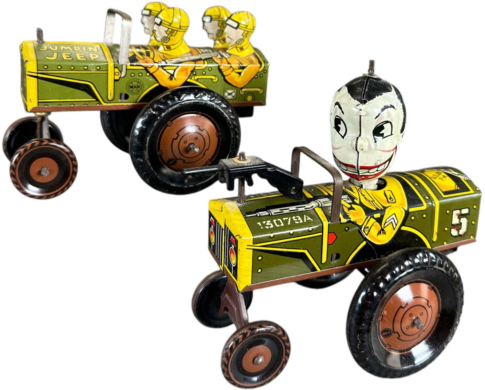MARX JUMPIN JEEP & JOLLY JOE WIND-UPS: 362. MARX JUMPIN JEEP & JOLLY JOE WIND-UPS | USA, wind-up driven. Jumping jeep wheels move in one vigorous motion(not on surface) making machine gun gear sound; Joe spins head attentively to possible 