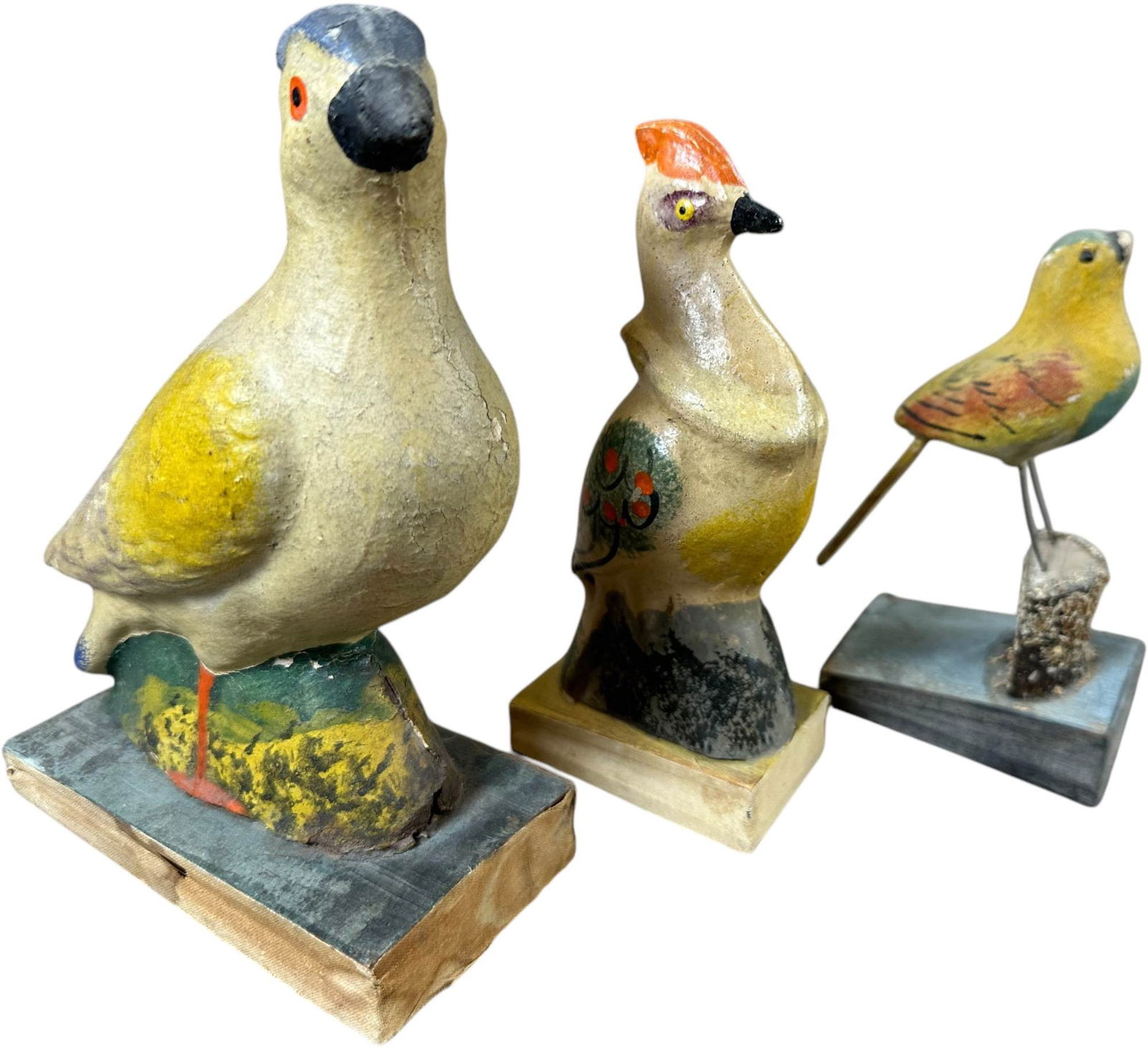 THREE GERMAN BIRD SQUEAK TOYS: 87. THREE GERMAN BIRD SQUEAK TOYS | Germany, compress bottom bellows for squeak. The Curtis & Linda Smith Collection. 7" h. | Largest bird faint squeaking and has the very tip of horn touched up, over