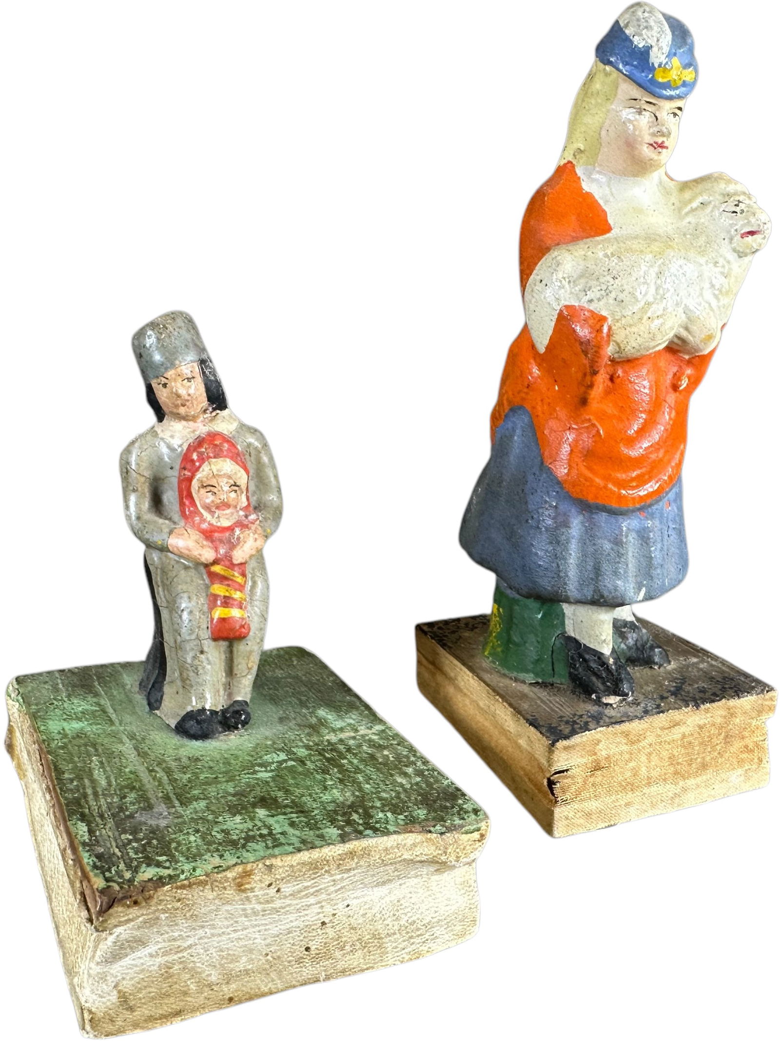 TWO STANDING FIGURE SQUEAK TOYS: 94. TWO STANDING FIGURE SQUEAK TOYS | Germany, Mary holding her lamb and a child holding her doll, compress bottom bellows for squeak. The Curtis & Linda Smith Collection. 4.5" h. | (Excellent to Pris