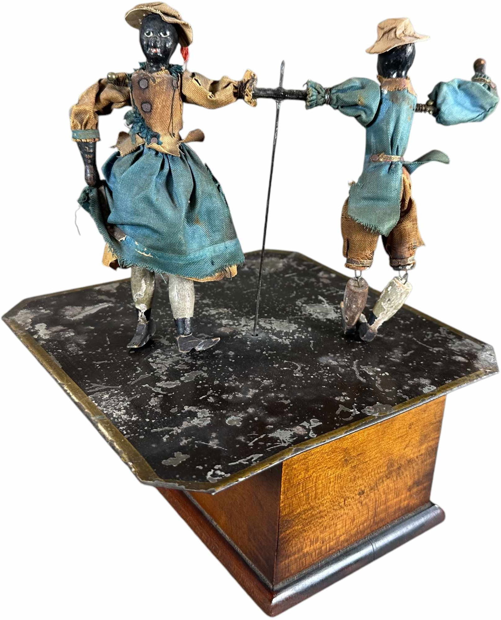 IVES MECHANICAL CAKE WALK DANCERS: 103. IVES MECHANICAL CAKE WALK DANCERS | Also attributed to Automatic Toy Works, circa 1880s, this is a scarce and seldom offered clockwork American toy, wooden base conceals clockwork motor, when act