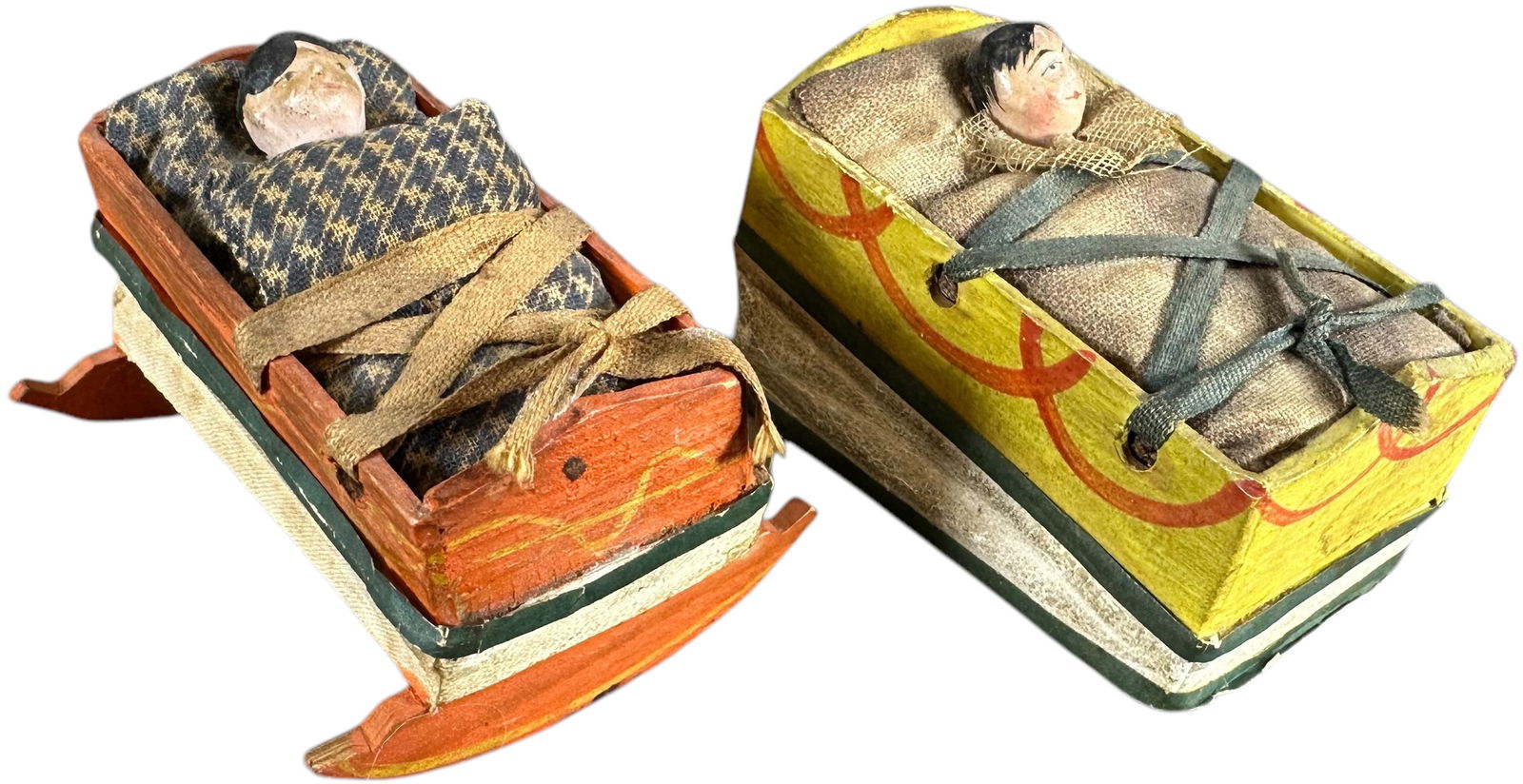 TWO BABY IN CRADLE SQUEAK TOYS: 124. TWO BABY IN CRADLE SQUEAK TOYS | Germany, compress bottom bellows for squeak. The Curtis & Linda Smith Collection. 2.5" l. | One missing rockers, (Excellent Condition) | $400 - $800