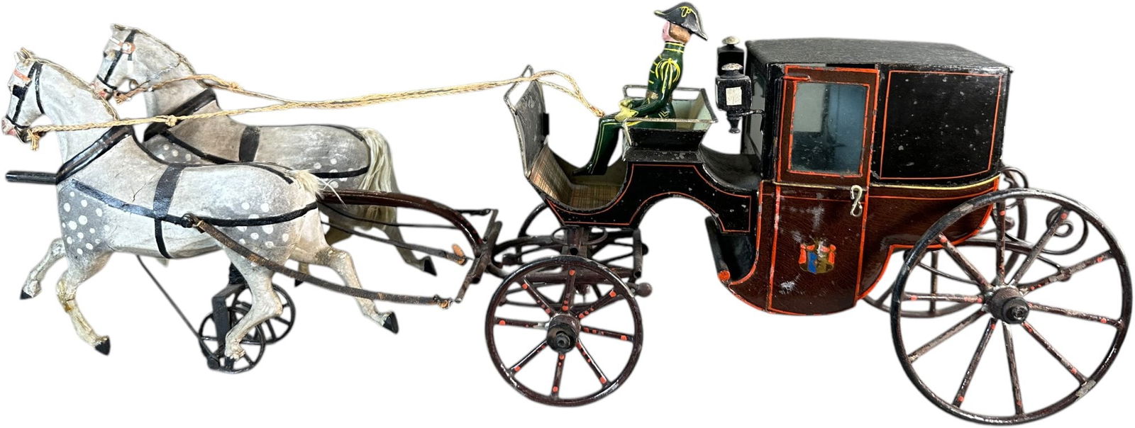 LARGE BUCHNER LANDAU CARRIAGE: 246. LARGE BUCHNER LANDAU CARRIAGE | Germany, circa 1880s, attractive landau carriage with family crests on the two opening doors and cast lanterns to help the composition horses and driver see their