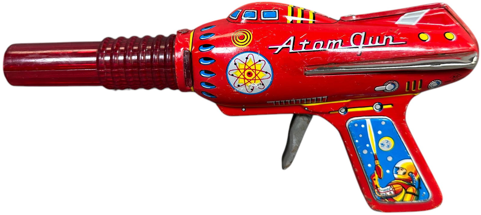 KO YOSHIYA ATOM SPACE RAY GUN: 285. KO YOSHIYA ATOM SPACE RAY GUN | Japan, very rare example, trigger causes gun to sparkle and emit sound. 9" l | Minor touchup near tabs and several small scratches on sides. | $500 - $800