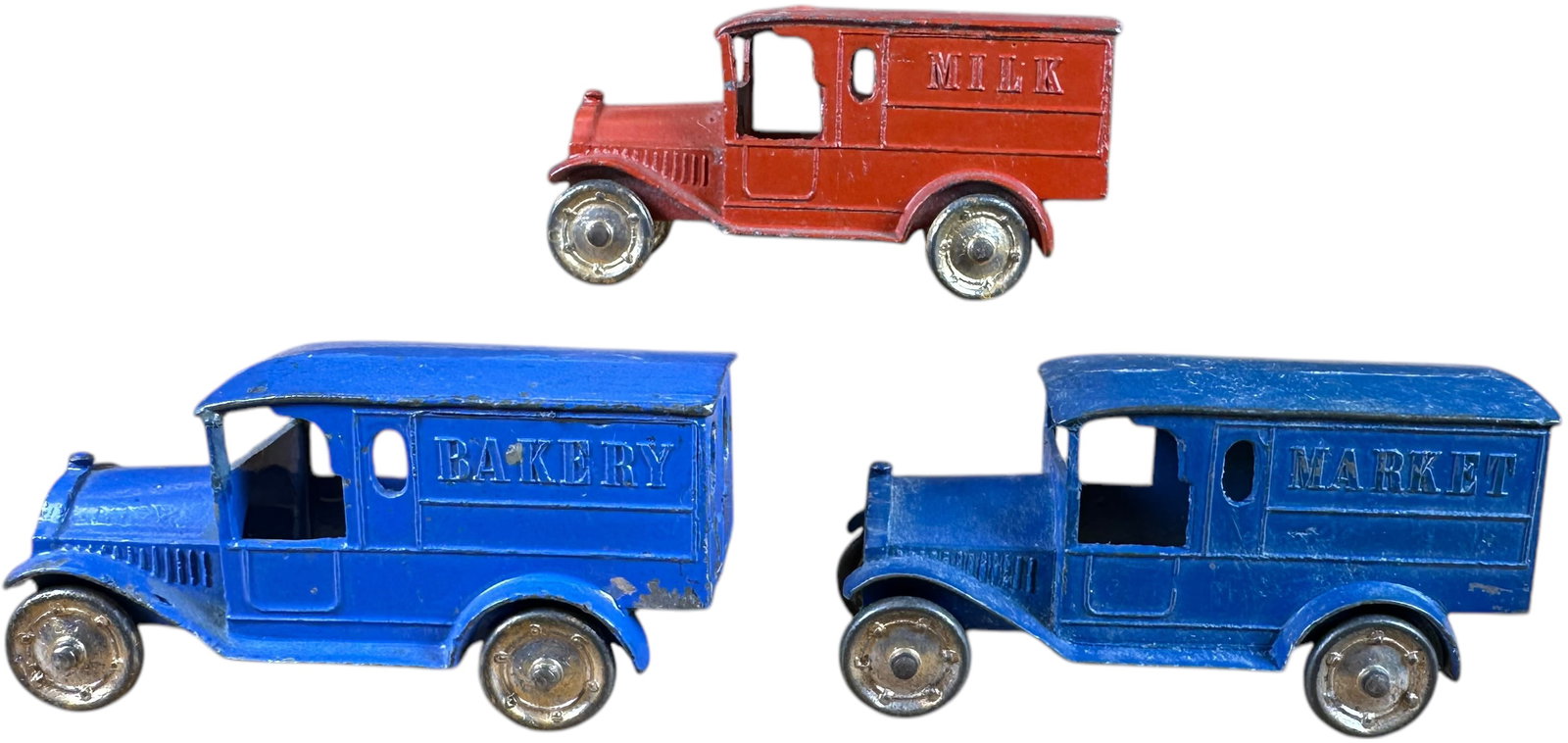 TOOTSIETOY THREE FEDERAL VANS: 183. TOOTSIETOY THREE FEDERAL VANS | Three vans marked Milk, Bakery, and market all in original condition. | 3" l. | (Excellent Condition) | $150 - $300