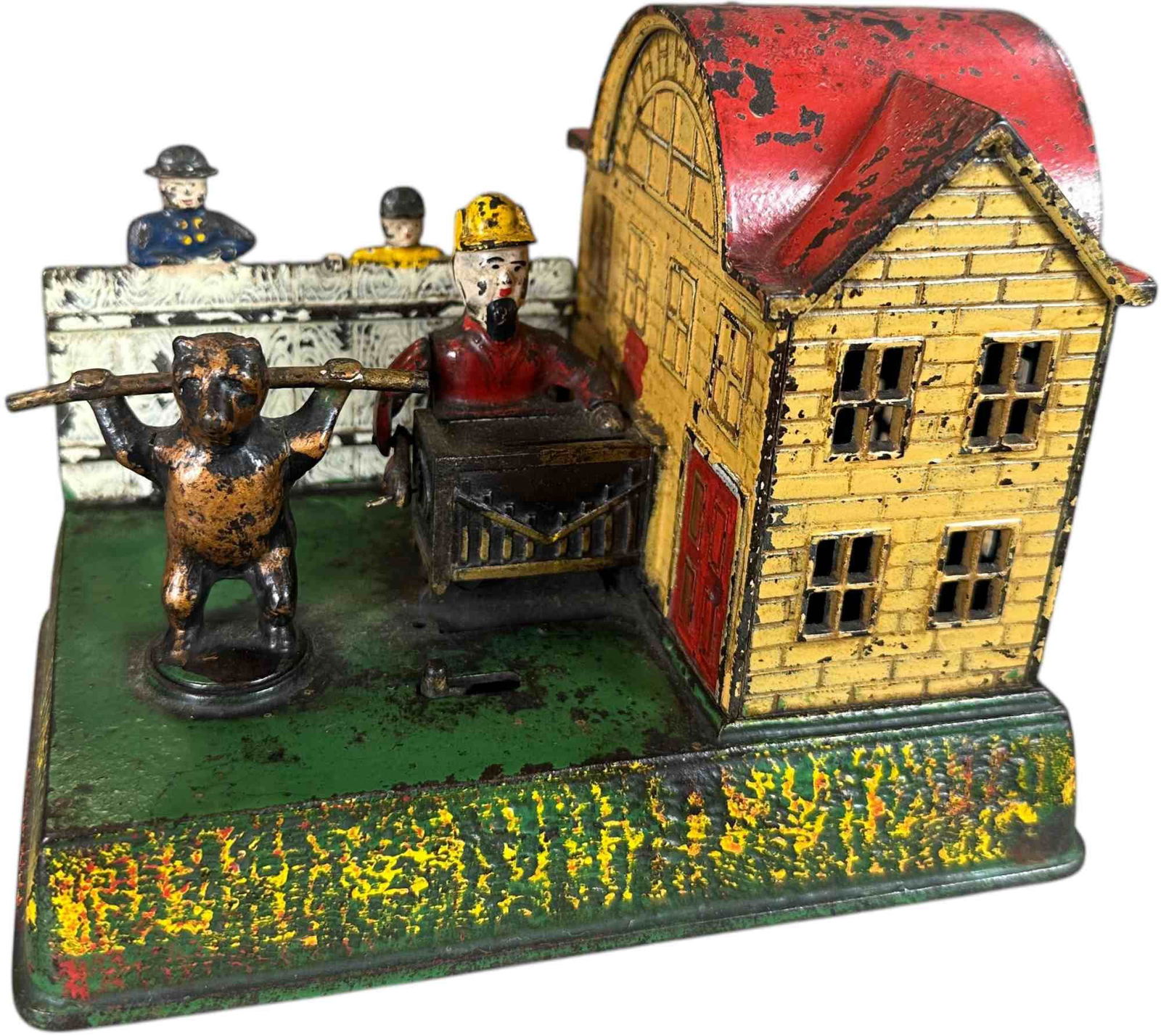 ORGAN GRINDER PERFORMING BEAR MECHANICAL BANK: 419. ORGAN GRINDER PERFORMING BEAR MECHANICAL BANK | Kyser & Rex Mfg. One of few clockwork activated banks, once wound the man cranks his organ as the bear revolves and a bell chimes from inside house