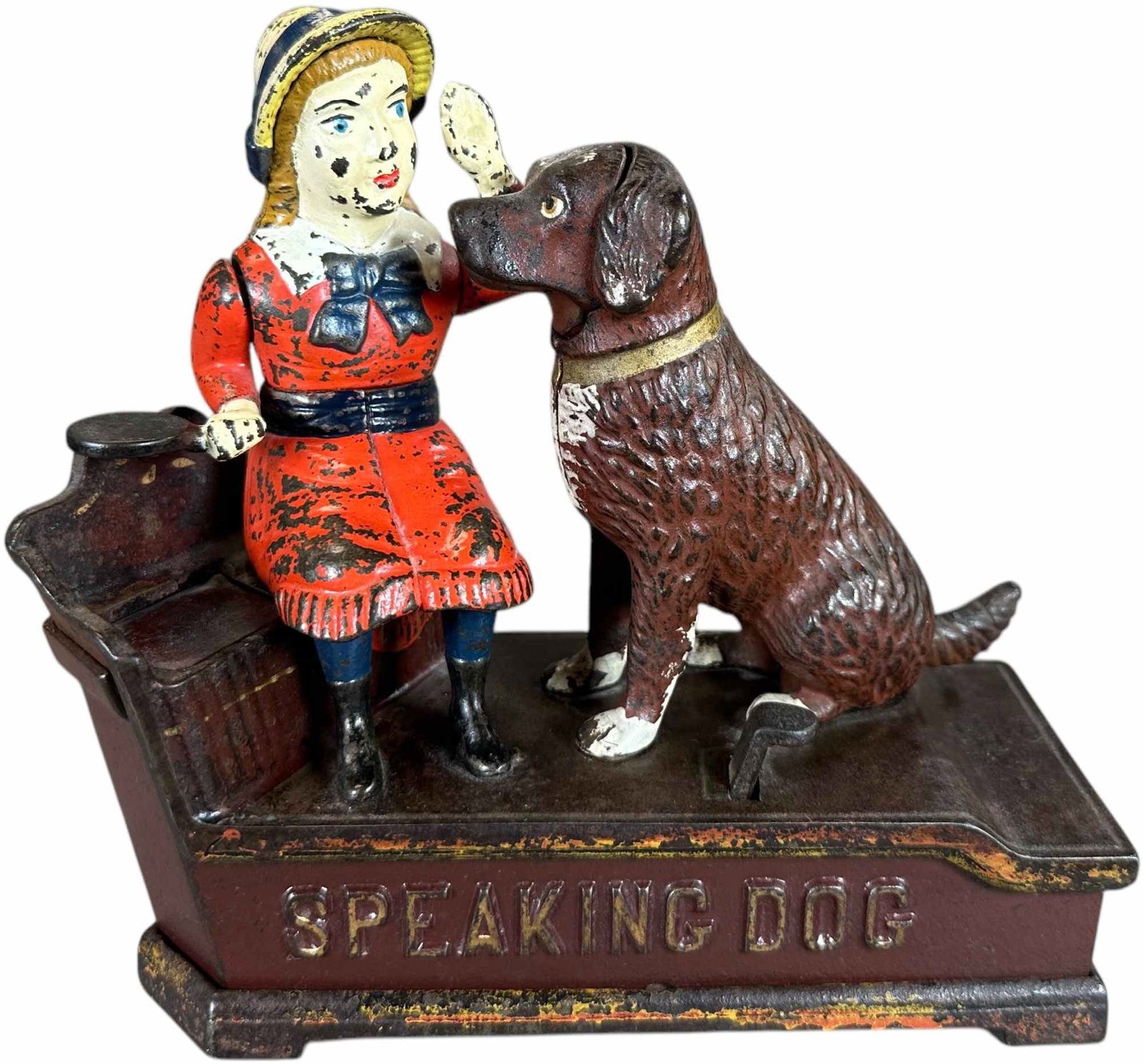 SPEAKING DOG MECHANICAL BANK: 497. SPEAKING DOG MECHANICAL BANK | J&E Stevens Co. | 8" l. | Replaced trap, girl has repaint, overall (Very Good to Excellent Condition) | $300 - $600