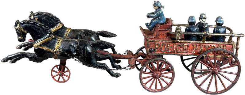 HUBLEY POLICE PATROL HORSE DRAWN WAGON: 569. HUBLEY POLICE PATROL HORSE DRAWN WAGON | 20.5" l. | Hitch and wheels are repainted, seat is overpainted, driver figure is authentic while others are replacements, (Very Good Condition) | $300 - $
