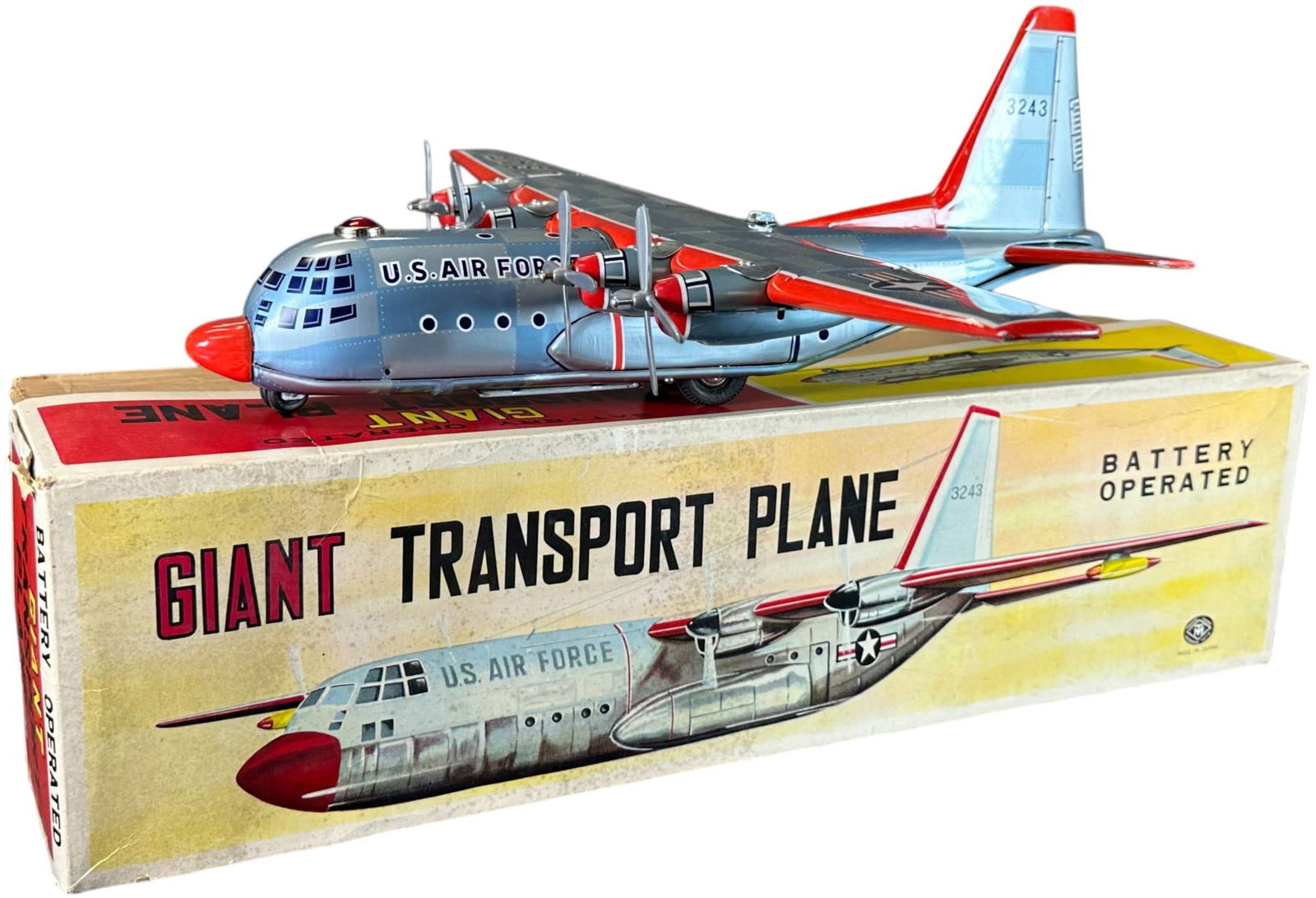 BOXED MODERN TOYS GIANT TRANSPORTER PLANE: 57. BOXED MODERN TOYS GIANT TRANSPORTER PLANE | Japan, battery operated, wheels turn to drive plane forward, propellers spin, signal light on top lights up. | 22.5" wings. | Edge wear to box lid, over
