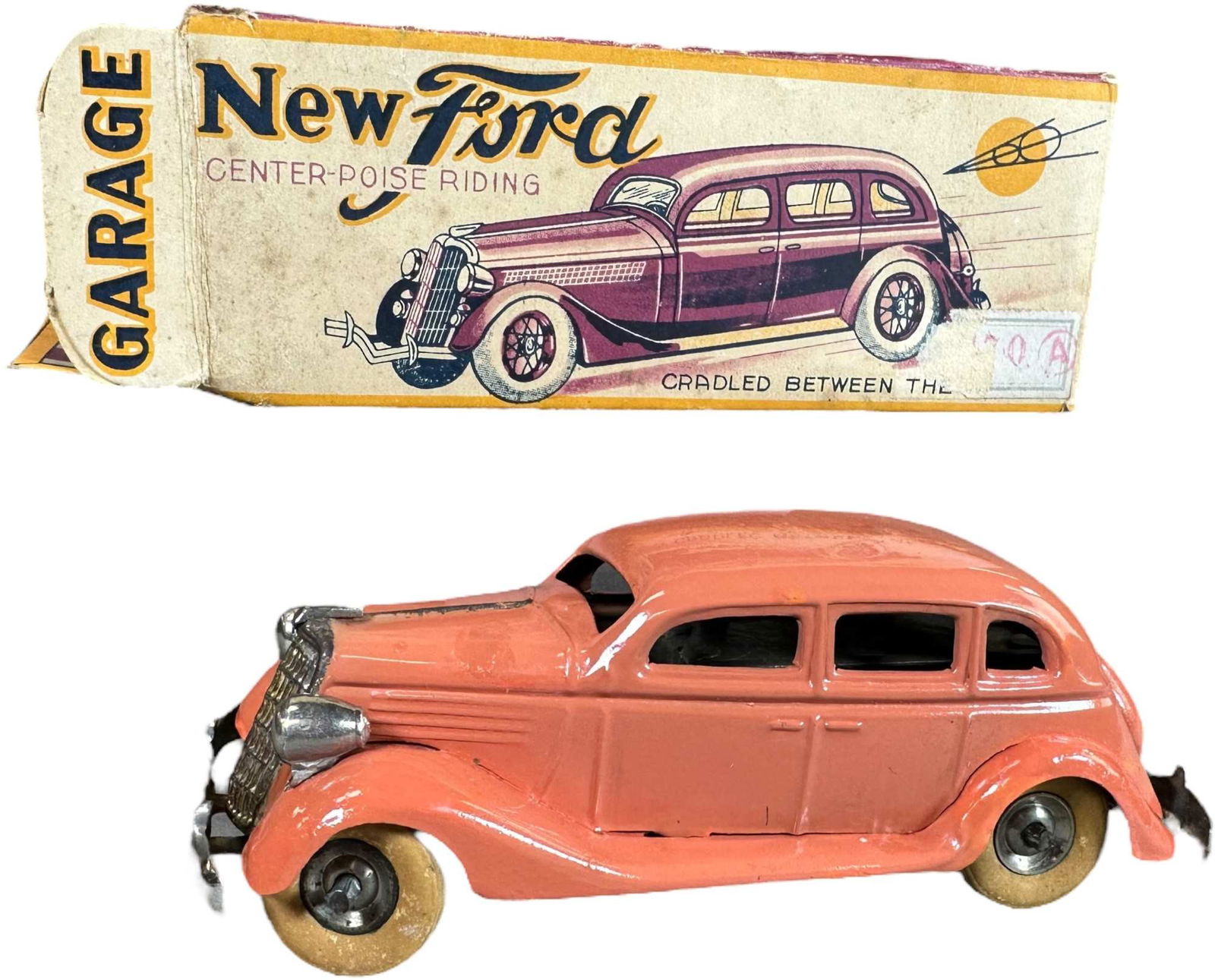 BOXED TT ASAKUSA 1935 NEW FORD SEDAN GARAGE: 74. BOXED TT ASAKUSA 1935 NEW FORD SEDAN GARAGE | Japan, working wind-up motor, "New Ford" made in Tokyo, box is designed to be used as a garage with windows, bricks, and shrubs on sides of building,
