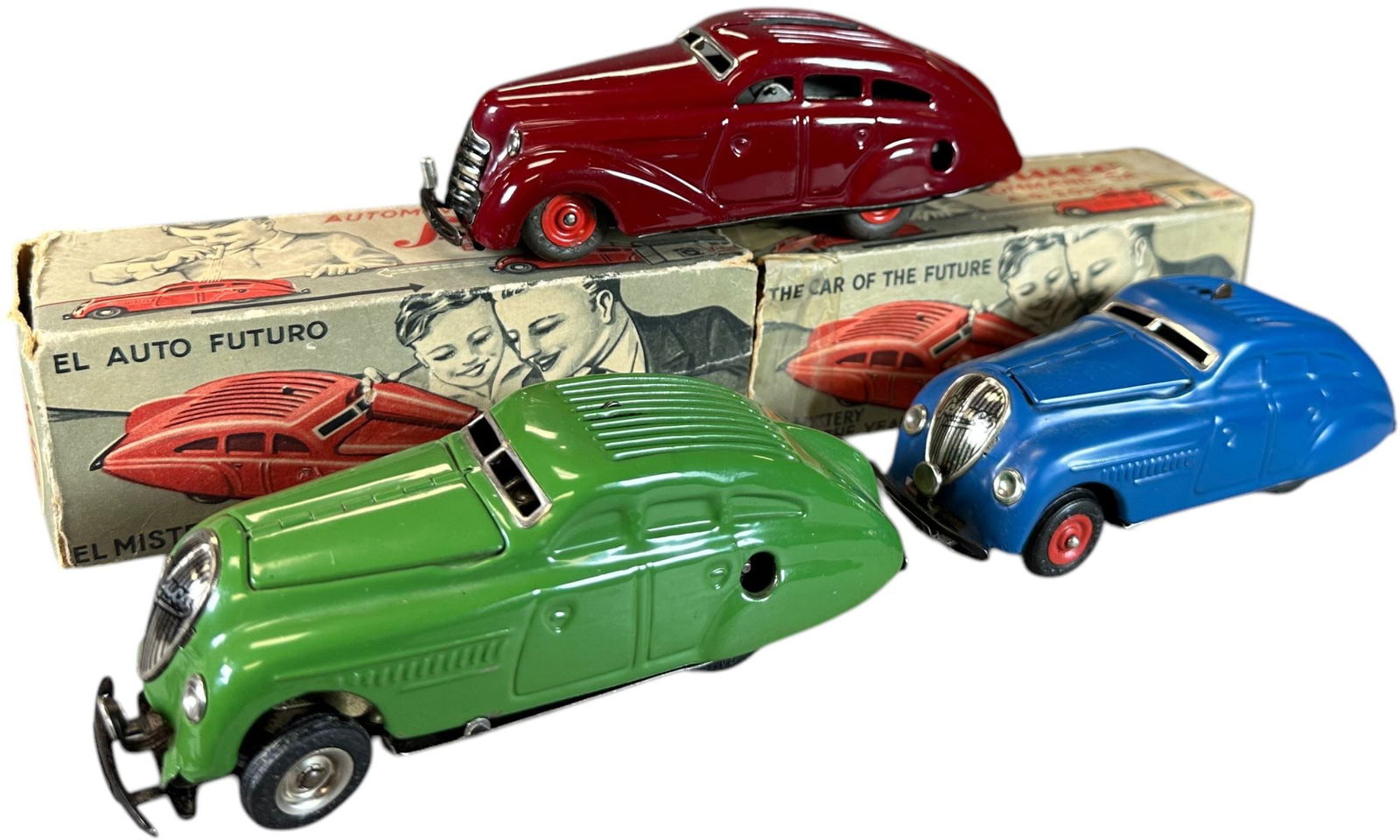 THREE SCHUCO 2000 AUTOS W/ BOXES: 129. THREE SCHUCO 2000 AUTOS W/ BOXES | Germany, working wind-up motor. Lot includes three Schuco: Patent Kommando 2000, Patent Magico-Auto 2008, Kommando Anno 2000 | 5.5" l. | Includes one instructio