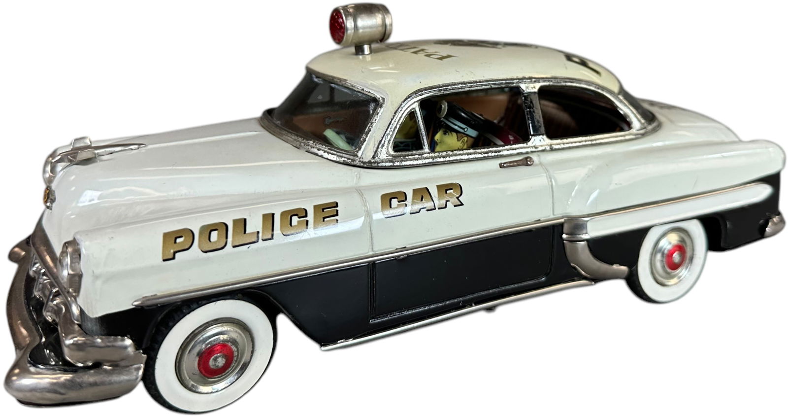 MARUSAN 1954 CHEVROLET POLICE PATROL CAR: 153. MARUSAN 1954 CHEVROLET POLICE PATROL CAR | Japan, battery-op motor not working at the time of testing. Ex: Ira Bernstein Collection. | 11" l. | A few minor factory touch ups as usual, all origina
