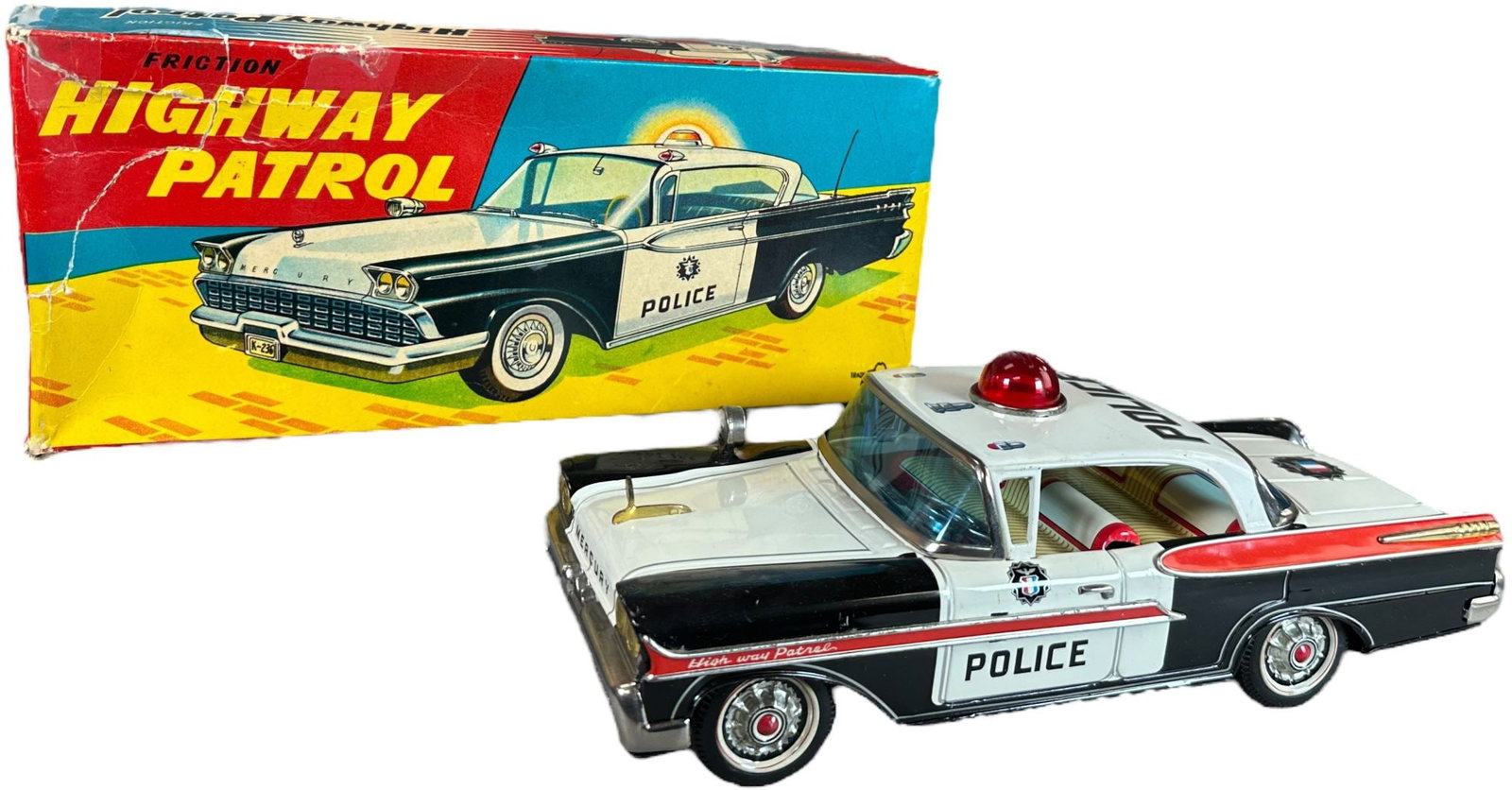BOXED YONEZAWA 1958 MERCURY HIGHWAY PATROL: 155. BOXED YONEZAWA 1958 MERCURY HIGHWAY PATROL | Japan, working friction driven motor. Ex: Ira Bernstein Collection. | 11.5" l. | Box has taped tears to top left corner of lid, toy in (Near Mint Cond