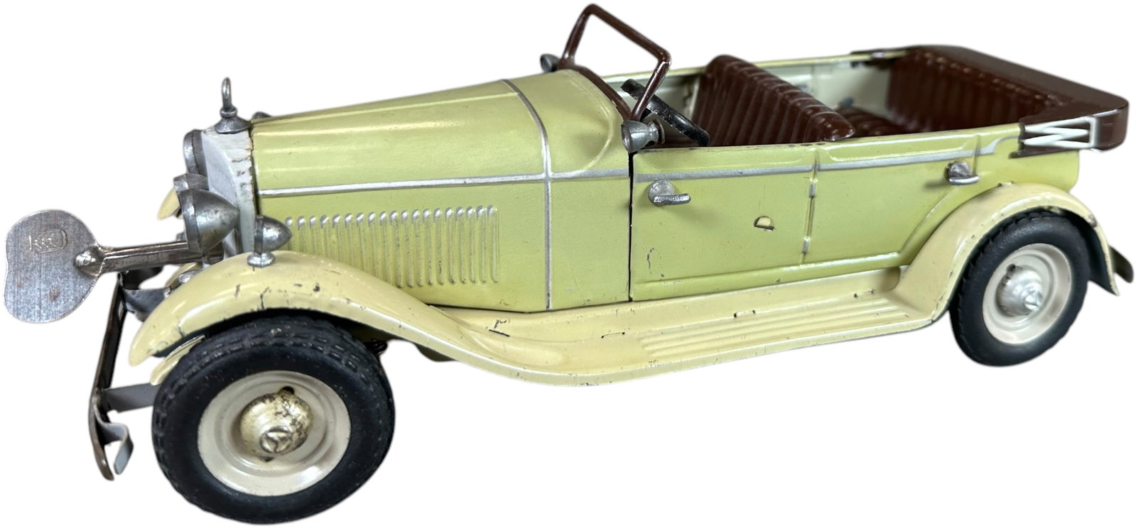 TIPPCO MERCEDES BENZ CREAM STAFF CAR: 219. TIPPCO MERCEDES BENZ CREAM STAFF CAR | Germany. Wind-up motor is working. Ex: Ira Bernstein Collection. | 9" l. | Driver's side rear left door handle is secured with glue, otherwise (Excellent Co