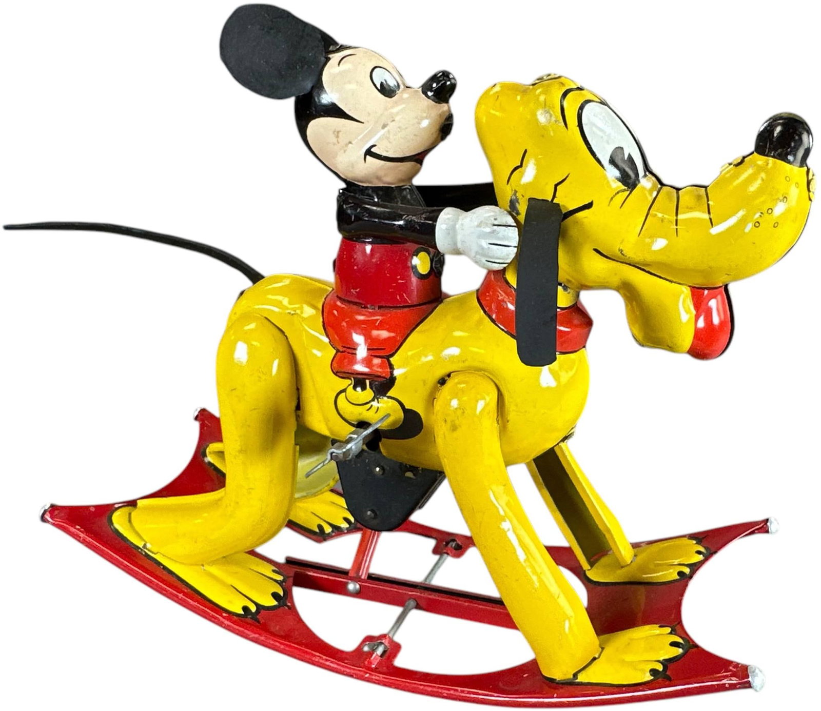 LINEMAR MICKEY MOUSE ON PLUTO: 296. LINEMAR MICKEY MOUSE ON PLUTO | Japan, wind-up motor. | 7" l. | Ears and tail are replacements, otherwise in (Excellent Condition) overall. | $500 - $1,000