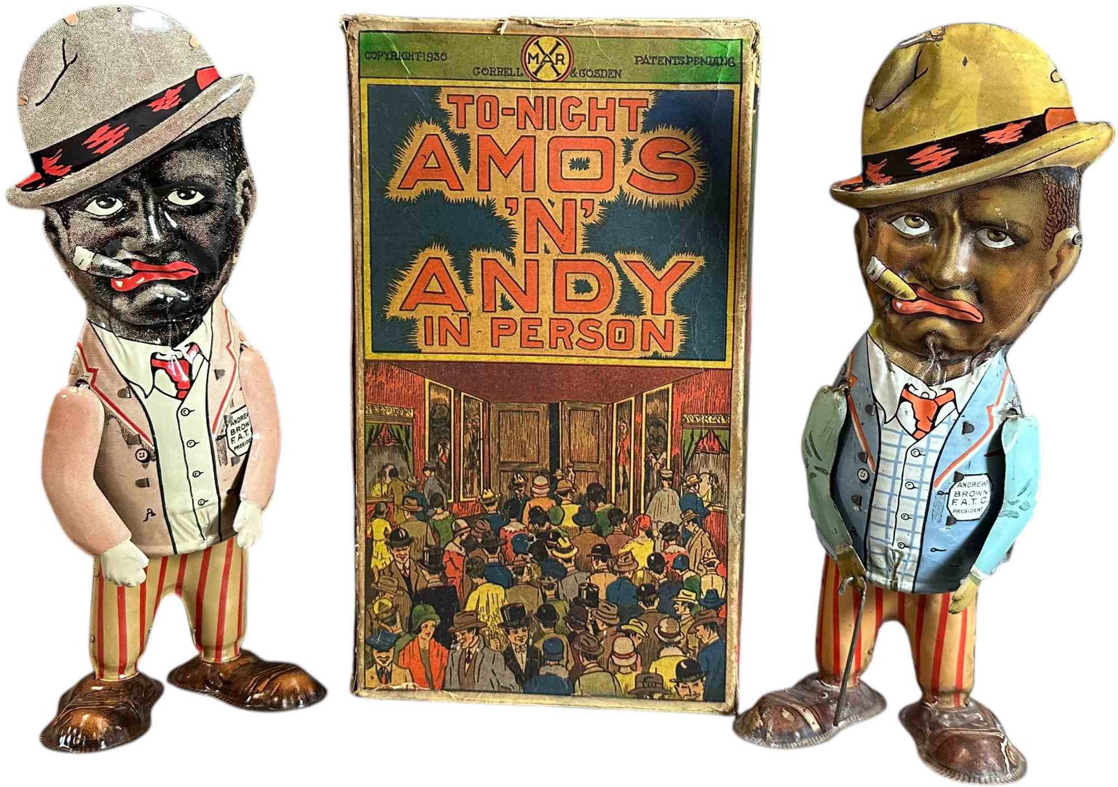 BOXED MARX AMOS & &Y WALKERS: 309. BOXED MARX AMOS & &Y WALKERS | USA, wind-up motor. Large size walkers, fixed eyes versions which were sold as a boxed pair, wind-ups at rear. | 11" l. | Box has some replaced flaps, relined with 