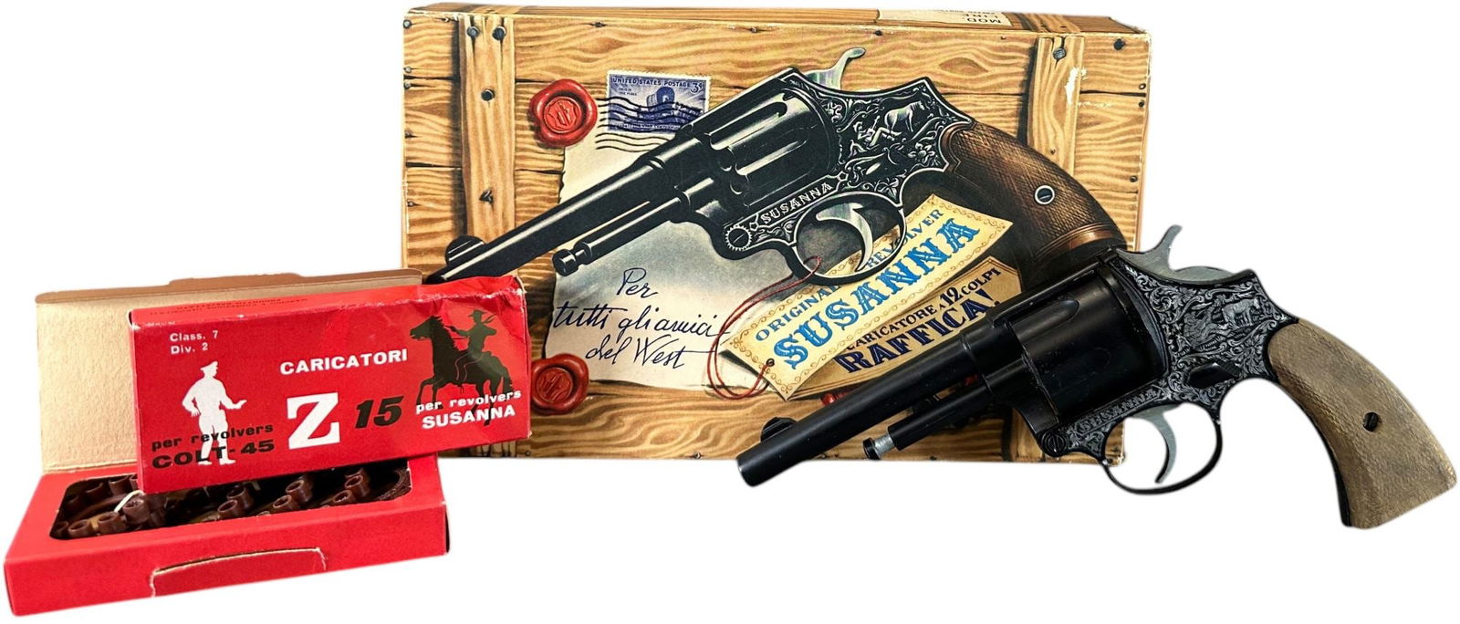 BOXED SUSANNA 12 SHOT 45 REVOLVER CAP GUN: 392. BOXED SUSANNA 12 SHOT 45 REVOLVER CAP GUN | Includes original Italian packaging and caps. | 8" l. | One box end flap detached, (Excellent to Pristine Condition) | $200 - $400