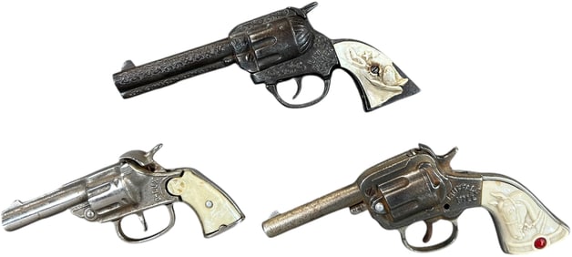 THREE CHILDRENS WESTERN STYLE CAP GUNS
