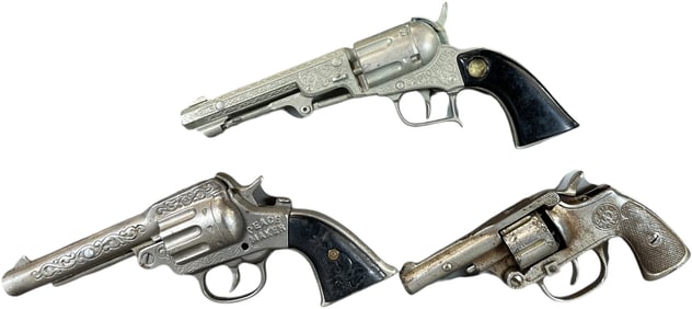 THREE CHILDRENS CAP GUN PISTOLS