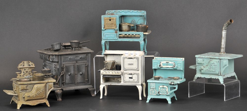 GROUPING OF MINIATURE CAST IRON STOVES: 5" to 6" h.