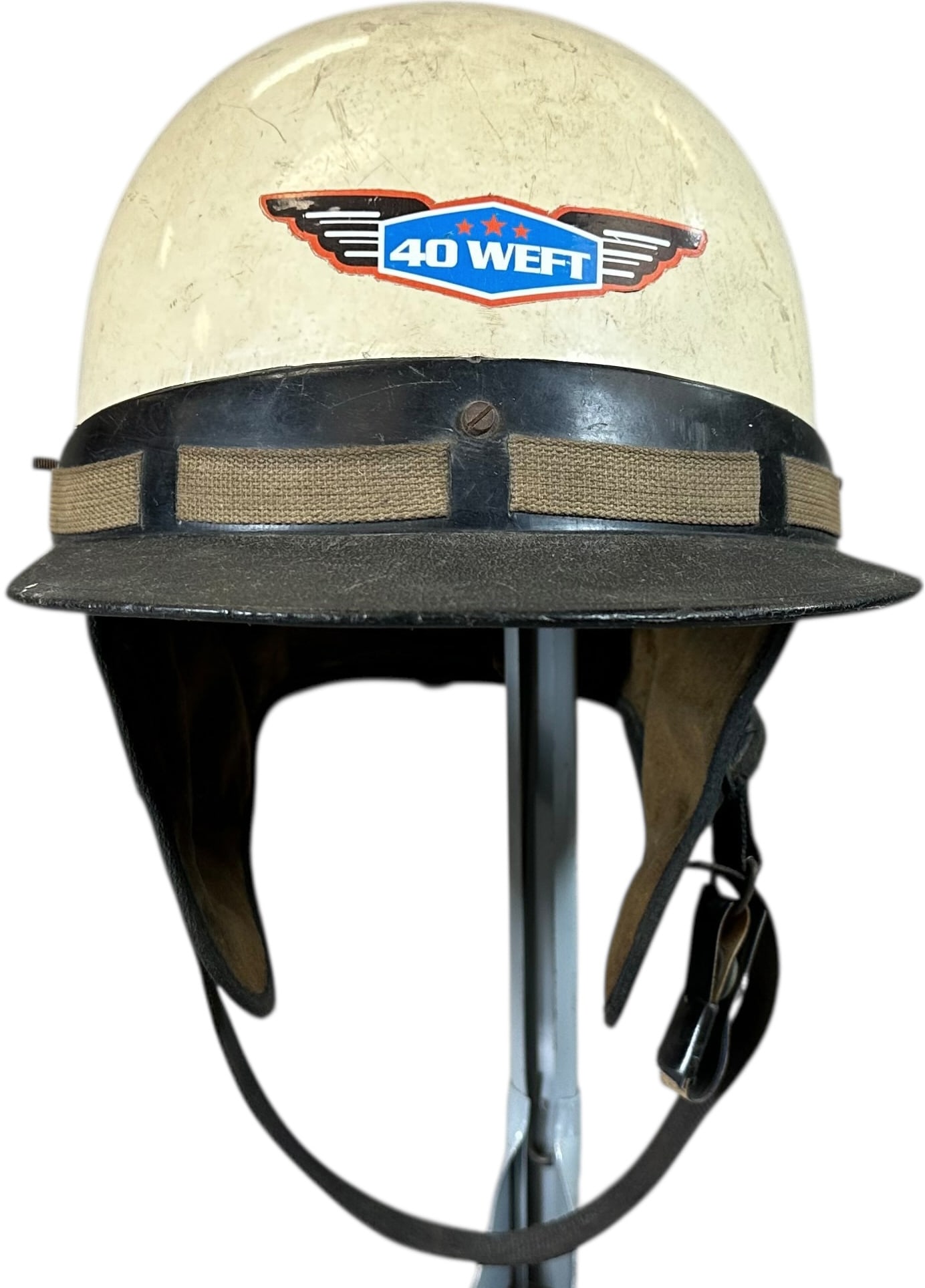 40 WEFT ADULT MOTORCYCLE HELMET: 103. 40 WEFT ADULT MOTORCYCLE HELMET | Marked 6 7/6 A. Cromwell Helmet From the Italian collection of Steno Tonelli. | 8" dia. | (Very Good Condition) | $100 - $200