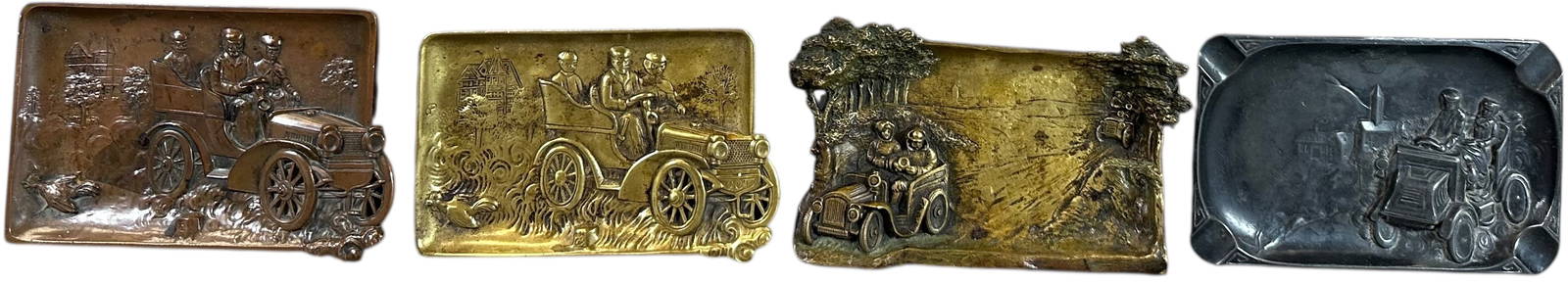 FOUR EARLY OPEN AUTOMOBILE ASHTRAYS: 181. FOUR EARLY OPEN AUTOMOBILE ASHTRAYS | Two brass and two spelter ashtrays. From the David Bausch Automobilia collection. | 6.5" l. | (Excellent Condition) | $200 - $400