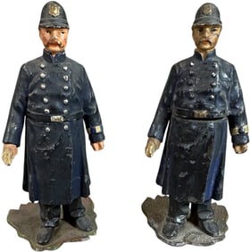 TWO SPELTER METAL POLICE FIGURE MATCH HOLDERS