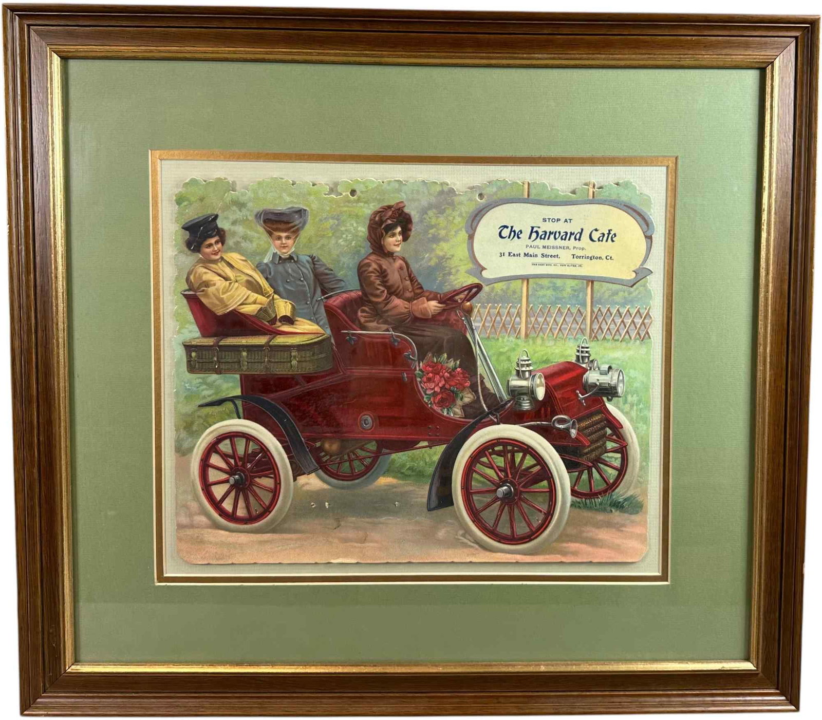 FRAMED HARVARD CAFE CALENDAR CUTOUT: 311. FRAMED HARVARD CAFE CALENDAR CUTOUT | Paul Meissner of 31 E Main Street, Torrington, CT. Matted behind glass in wooden frame. From the David Bausch Automobilia collection. | 22.5 x 20.5" l x h. |