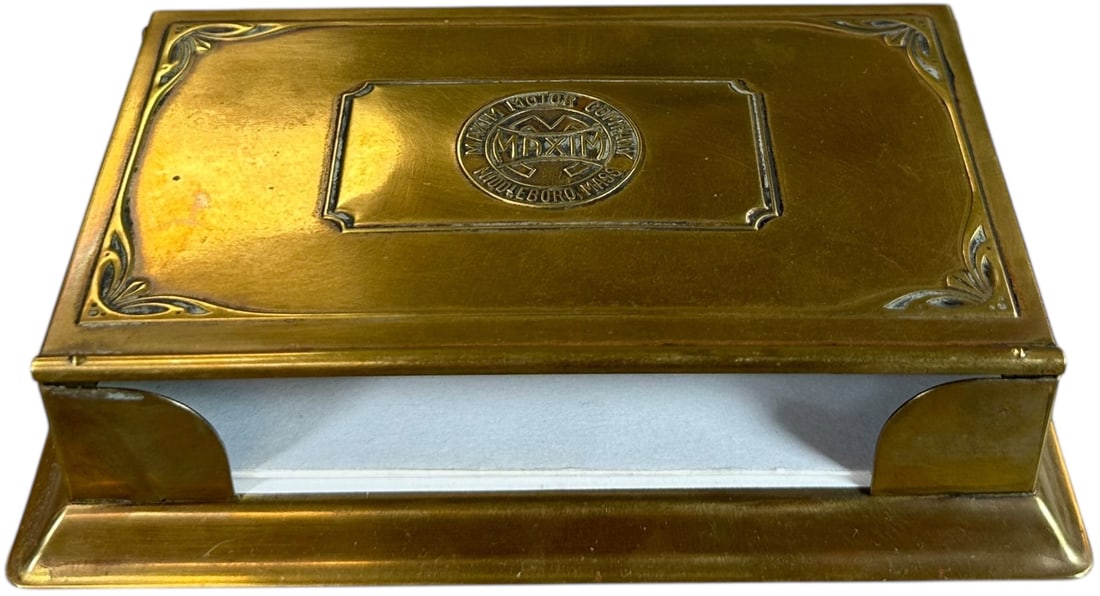 MAXIM MOTOR COMPANY BRASS NOTEPAD HOLDER: 342. MAXIM MOTOR COMPANY BRASS NOTEPAD HOLDER | From the David Bausch Automobilia collection. | 5.5" l. | (Excellent Condition) | $200 - $400