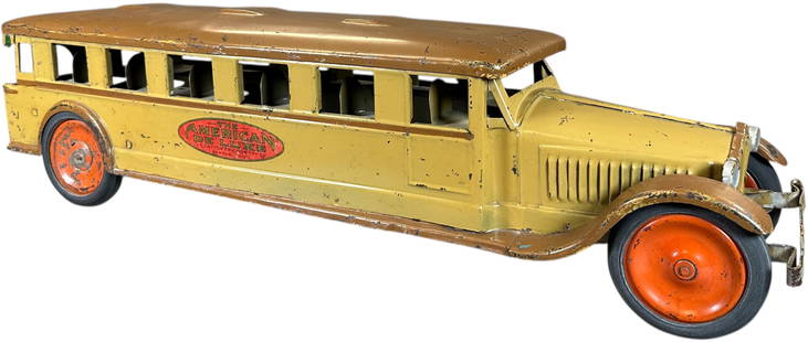 AMERICAN DELUXE BUS: 494. AMERICAN DELUXE BUS | 26" l. | Friction driven motor needs adjustment, original decals and paint in (Excellent Condition) | $400 - $800