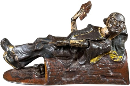 RECLINING CHINAMAN MECHANICAL BANK
