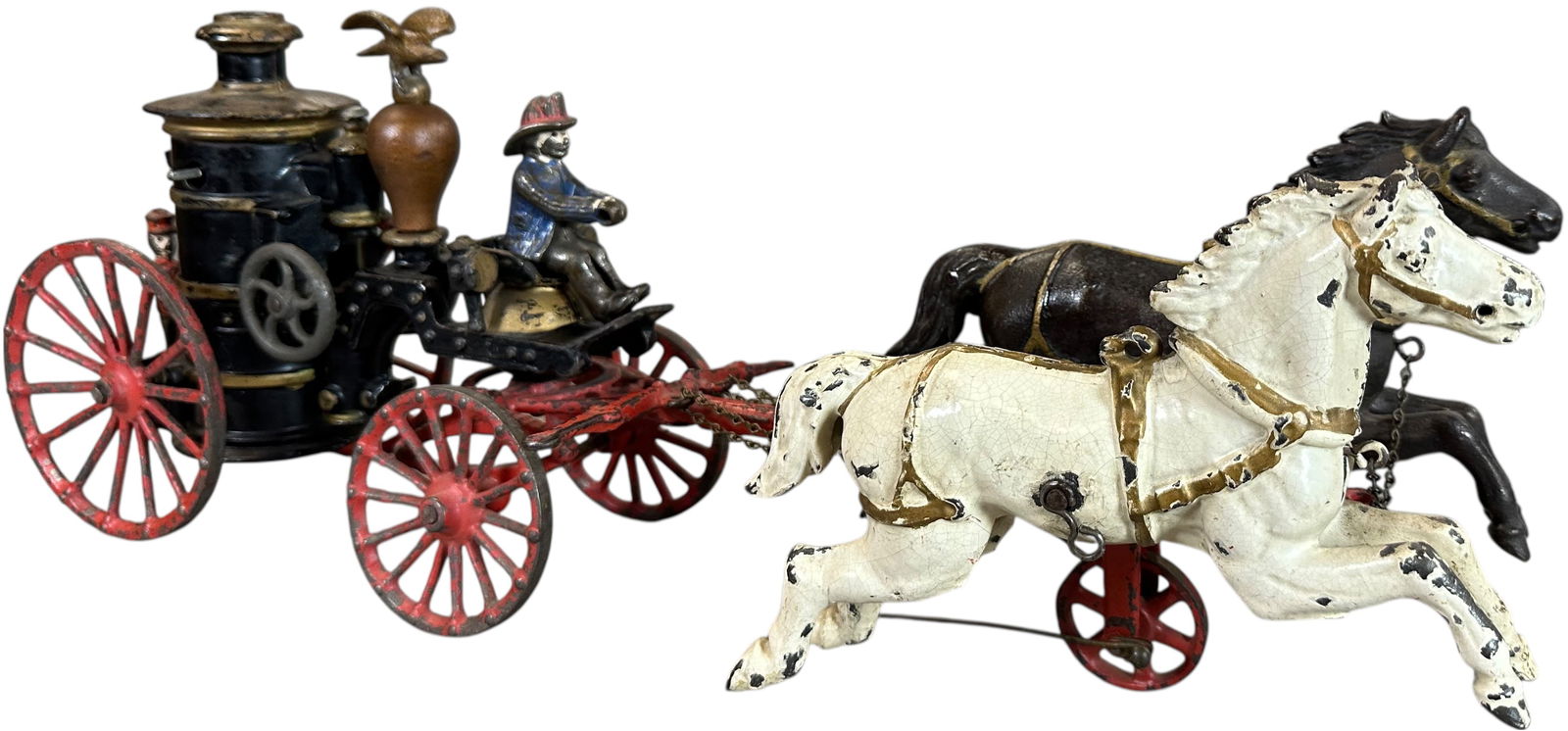IVES HORSE DRAWN FIRE PUMPER WAGON: 247. IVES HORSE DRAWN FIRE PUMPER WAGON | 19" l. | Replacement eagle and wood ball, otherwise toy is all original with great paint on horses, (Excellent Condition) for this early Ives toy! | $400 - $8