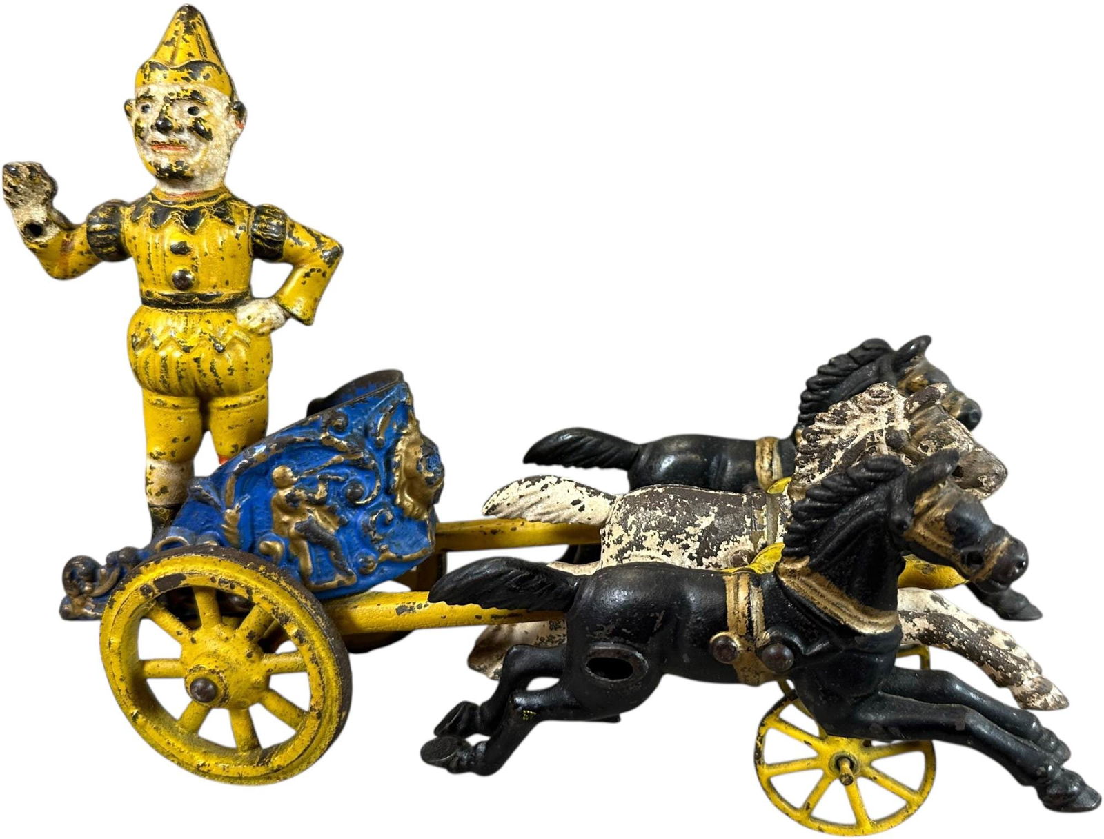 HUBLEY THREE HORSE CLOWN CHARIOT: 290. HUBLEY THREE HORSE CLOWN CHARIOT | With an authentic color variation clown. | 10" l. | (Very Good to Excellent Condition) | $300 - $600