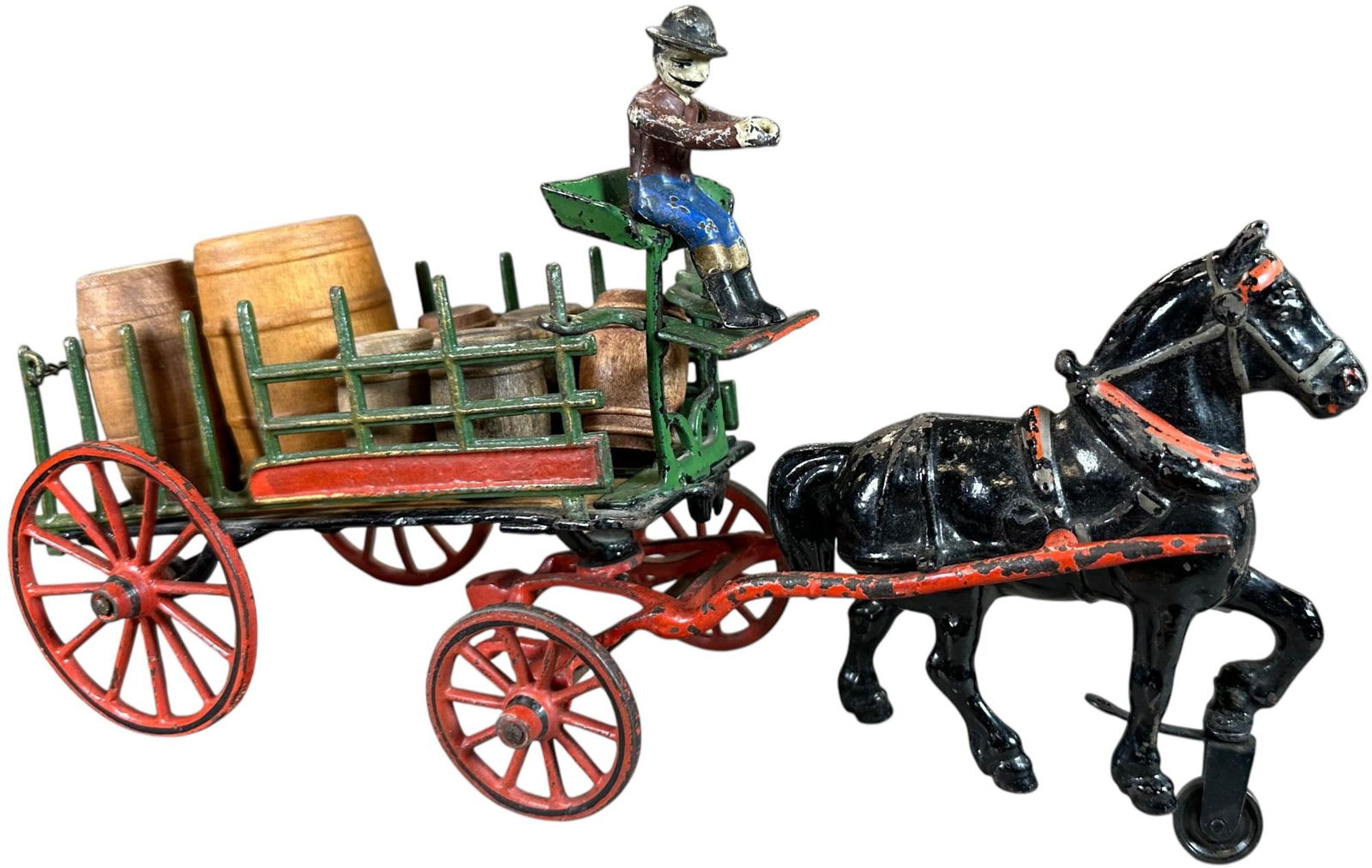 PRATT & LETCHWORTH DRAY WAGON: 300. PRATT & LETCHWORTH DRAY WAGON | Single horse version of this toy, original figure. | 13" l. | Original driver figure, stake sides are free from any breaks, two rear spokes repaired, (Excellent Co