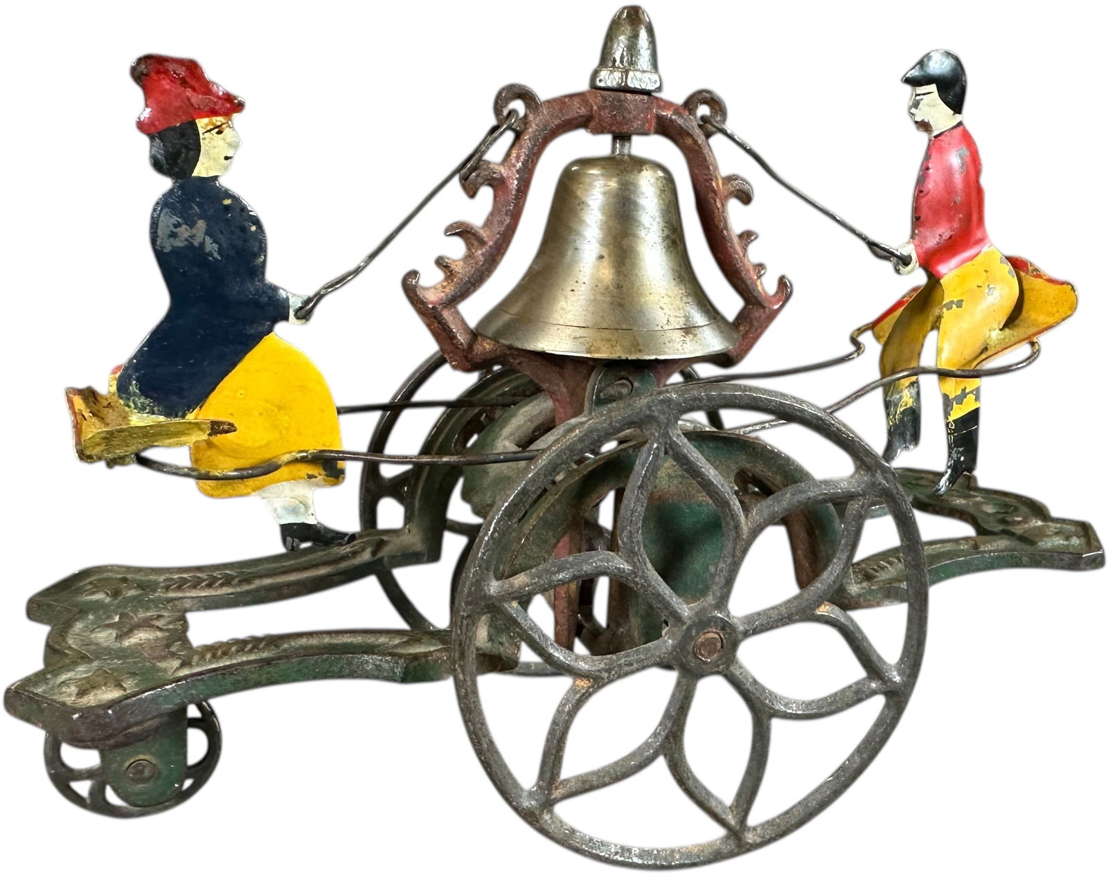 GONG BELL SEE SAW BELL TOY: 338. GONG BELL SEE SAW BELL TOY | No. 23, cast iron with hand painted tin figures. | 7.5" l. | Replaced figures, displaying in (Very Good to Excellent Condition) | $400 - $800