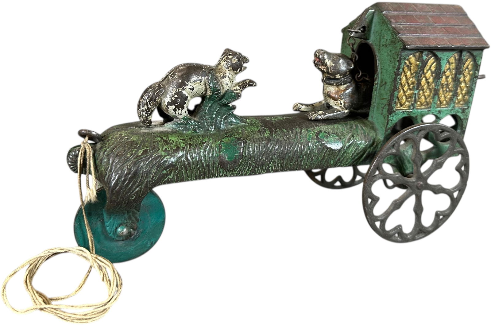 GONG BELL CAT AND DOG BELL TOY: 391. GONG BELL CAT AND DOG BELL TOY | Provenance: Richard Mueller Collection. | 9" l. | Front wheels replaced, otherwise (Very Good Condition) | $500 - $1,000