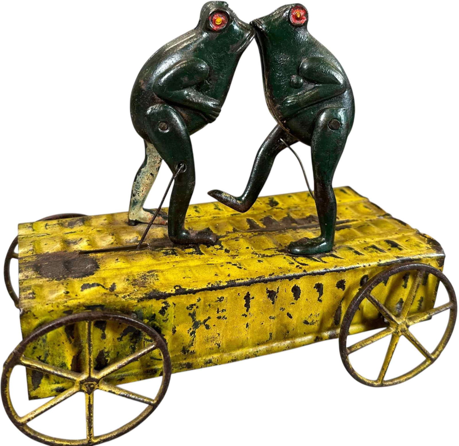 KICKING FROGS PULL TOY: 404. KICKING FROGS PULL TOY | 7" l. | Some overpaint to frogs, (Very Good Condition) | $200 - $400