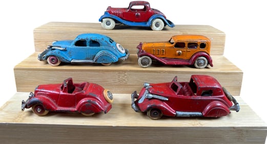 FIVE SMALL CAST IRON AUTOS