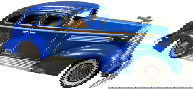 LARGE CK KURAMOCHI 1936 PONTIAC SEDAN: 5. LARGE CK KURAMOCHI 1936 PONTIAC SEDAN | A rare clockwork sedan, large scale model, well detailed with extensive nickel trim. Provenance: The Kaufman Collection #3056. | 11" l. | Some paint