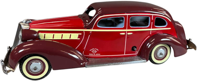 TN NOMURA 1936 PACKARD W/ ELECTRIC LIGHTS: 7. TN NOMURA 1936 PACKARD W/ ELECTRIC LIGHTS | Wind-up motor is working. Ex: Ira Bernstein Collection. | 11" l. | Professionally Restored to top standards, displays in (Pristine Condition) | $400 -