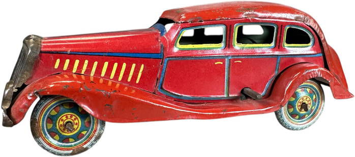 COLORFUL TT ASAKUSA KOSUGE 1930S SEDAN: 8. COLORFUL TT ASAKUSA KOSUGE 1930S SEDAN | Japan, working wind-up motor. Ex: Ira Bernstein Collection. | 7" l. | Authentic example with typical playwear, (Excellent Condition) | $200 - $400