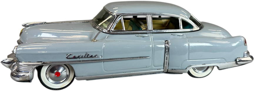MARUSAN 1950 CADILLAC: 16. MARUSAN 1950 CADILLAC | Ex: Ira Bernstein Collection. | 12" l. | Missing friction motor mechanism and one tab at underside, crack to windshield is glued, grey paint appears to be restored,