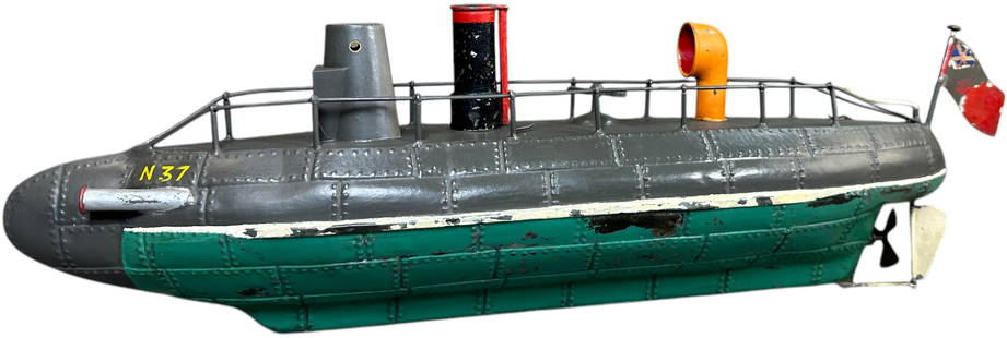 JEP FRANCE N37 TORPEDO BOAT SUBMARINE: 20. JEP FRANCE N37 TORPEDO BOAT SUBMARINE | Rare example, circa 1918-1924. From the Tony Cuff collection. | 19" l. | Original tin smokestack and flag, green portion of the hull is authentic, the