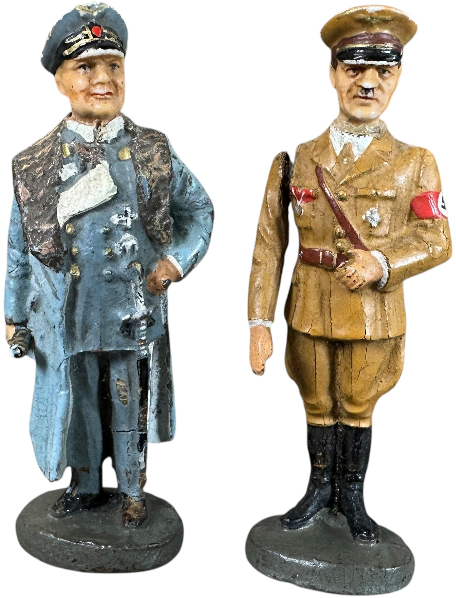 ELASTOLIN PORCELAIN HEAD POLITICAL FIGURES: 256. ELASTOLIN PORCELAIN HEAD POLITICAL FIGURES | Elastolin composition figures with porcelain heads of Goering and Hitler, Hitler figure has a moveable arm. From the Italian collection of Steno Tonel