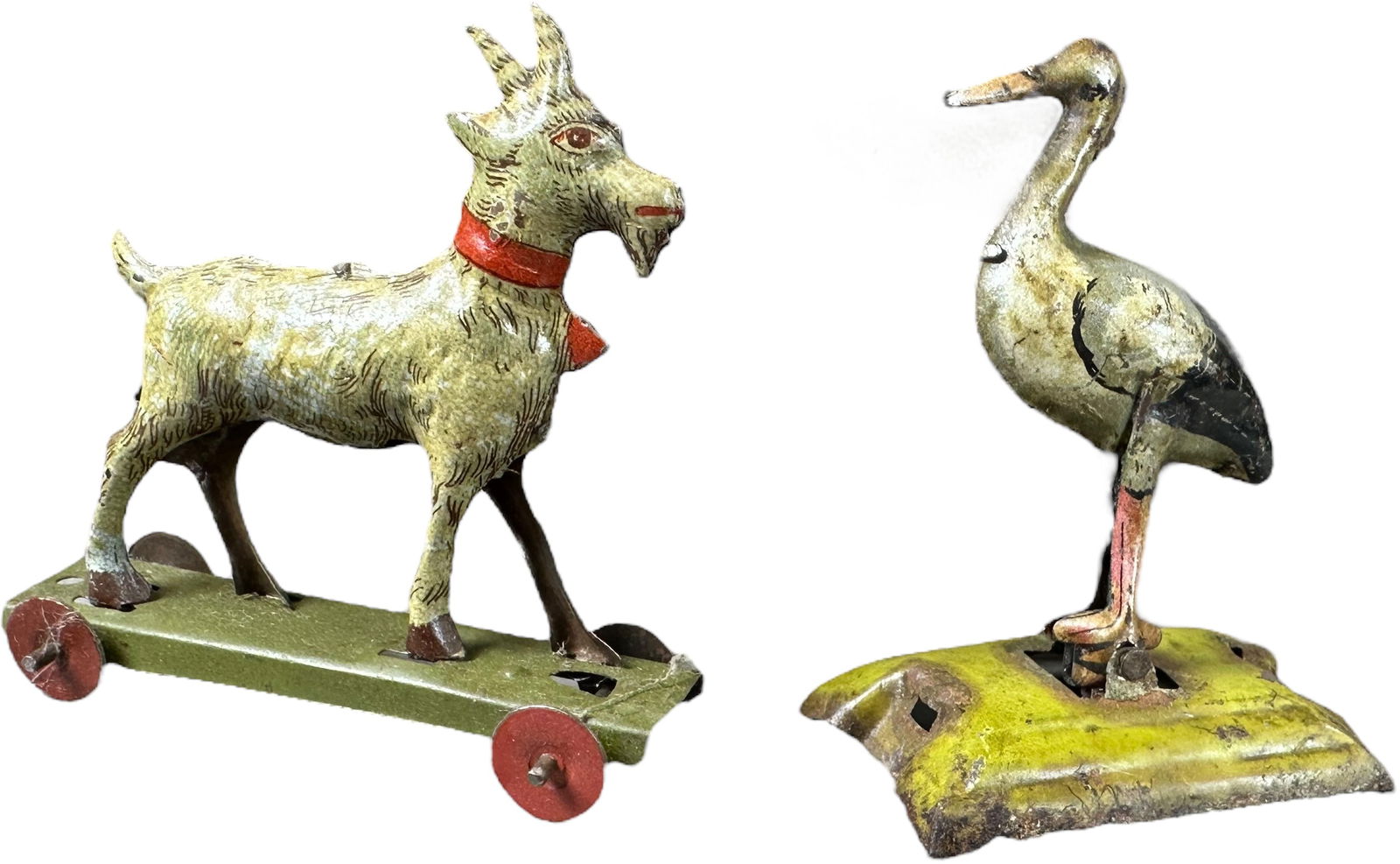 ARTICULATED STORK W/ BILLY GOAT PENNY TOY: 307. ARTICULATED STORK W/ BILLY GOAT PENNY TOY | Stork made by Fischer, Billy goat made by Meier. | 2.5" l. | Swan missing slider bar (Very Good to Excellent Condition), Goat in (Excellent to Pristine