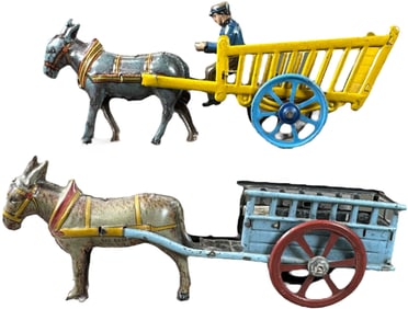 TWO OVERSIZED STAKE WAGON PENNY TOYS